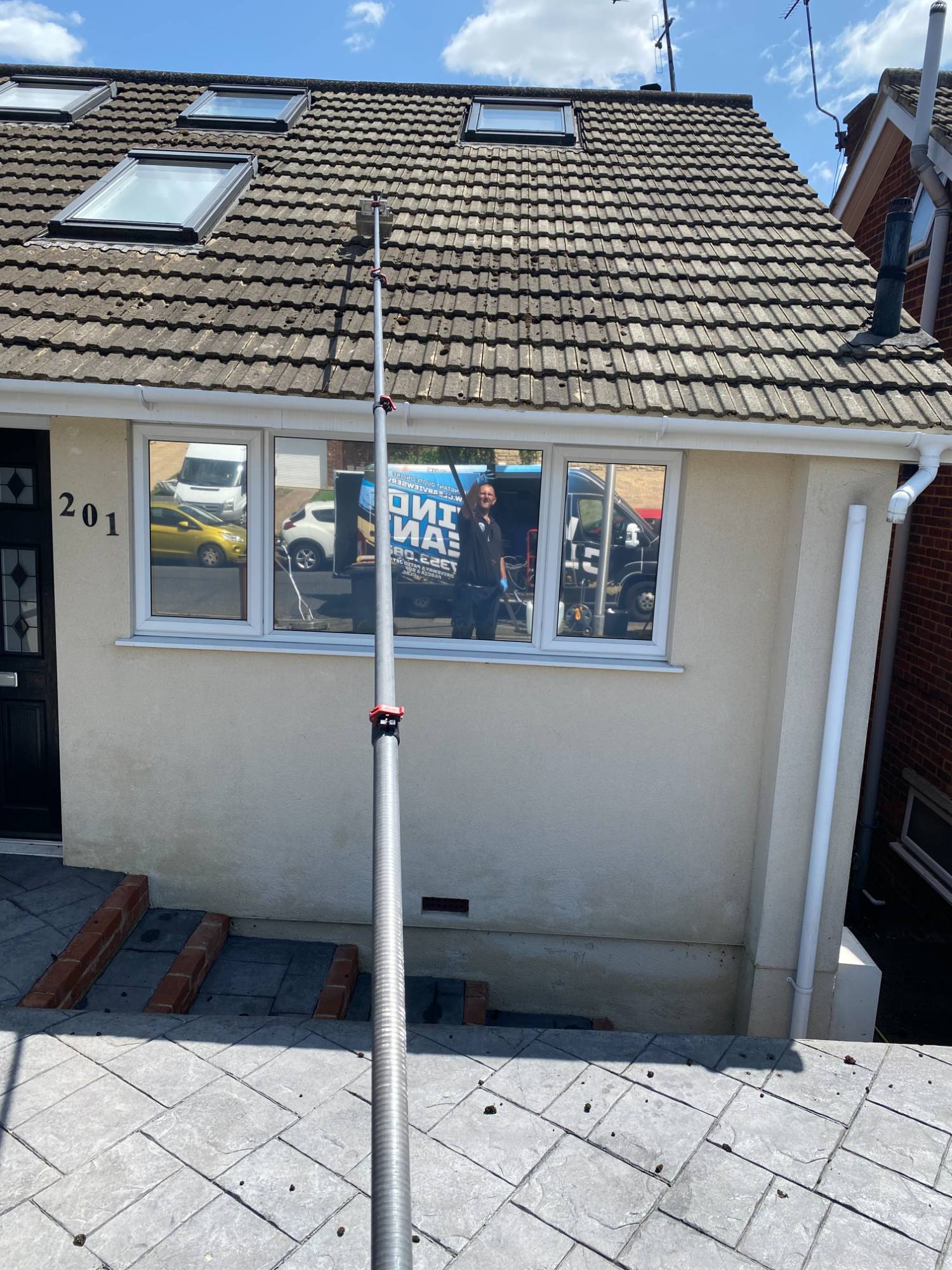 Roof scraping in progress on a Kent bungalow with hand tools